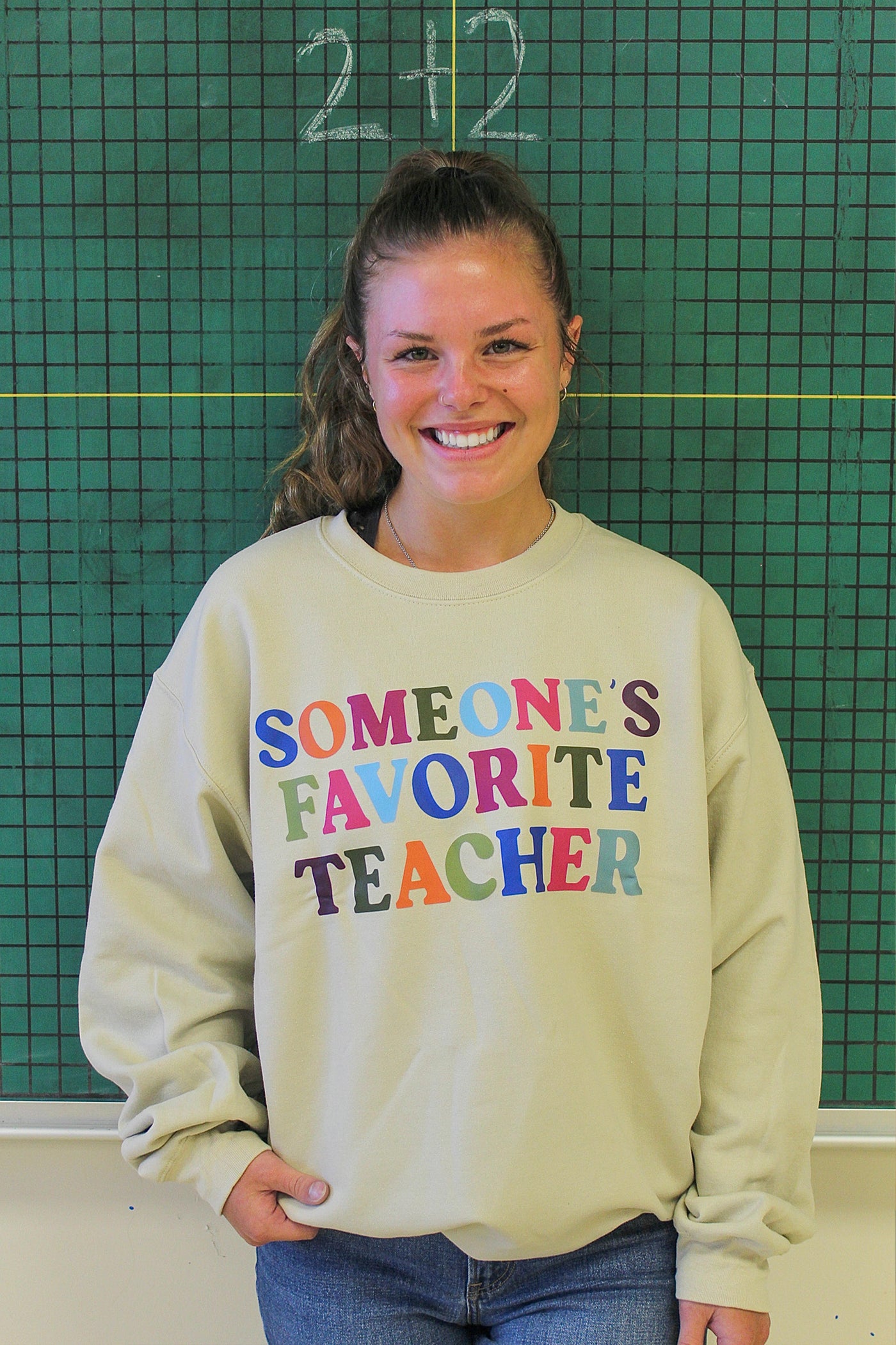 SOMEONE'S FAVORITE TEACHER GRAPHIC SWEATER