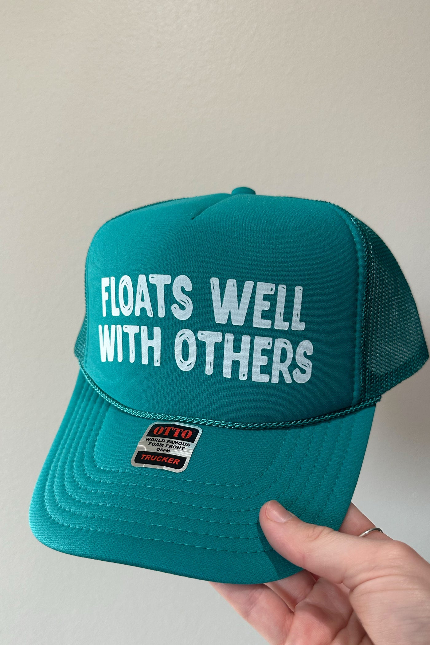 FLOATS WELL WITH OTHERS TRUCKER HAT