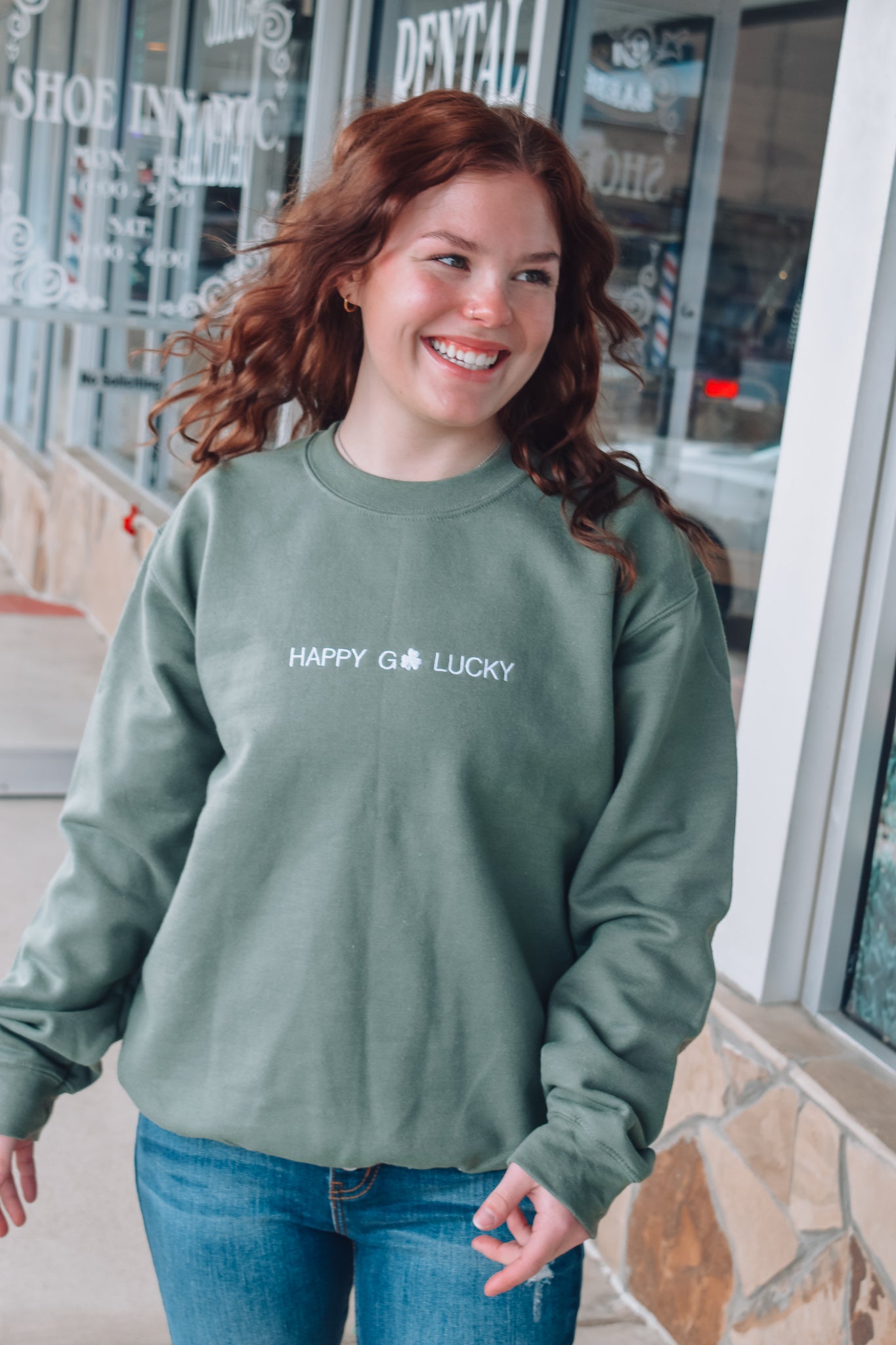 HAPPY GO LUCKY EMBROIDERED SWEATER