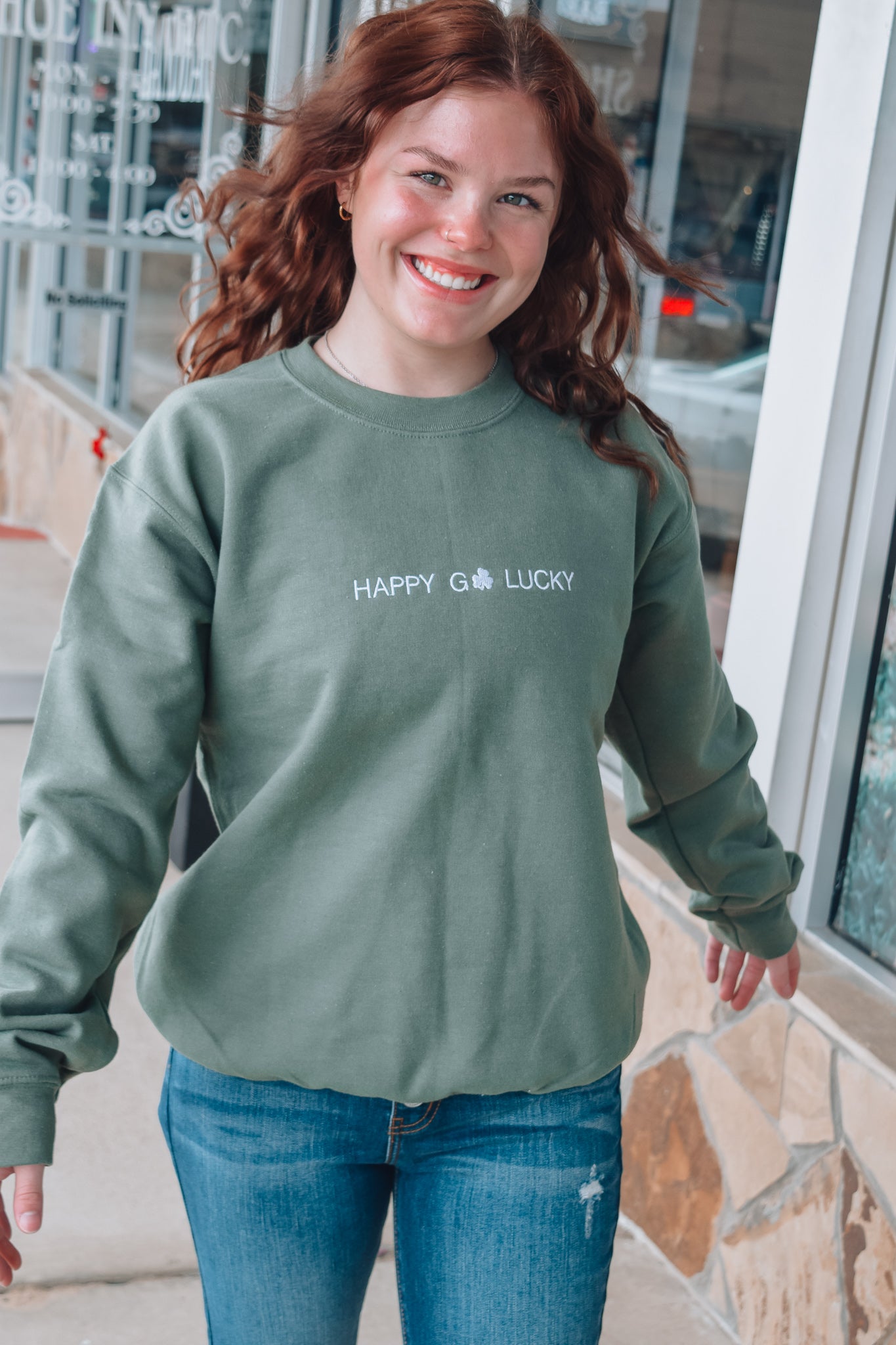 HAPPY GO LUCKY EMBROIDERED SWEATER